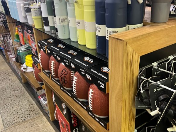 a group of people standing in front of a store
